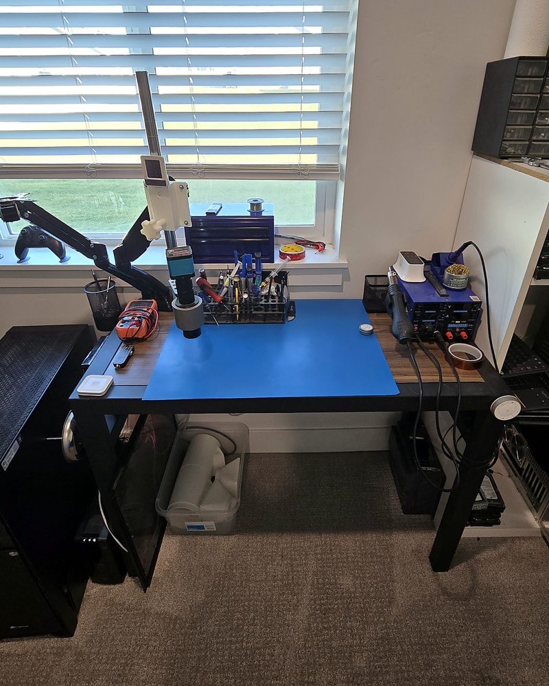 Our electronics bench with a microscope, soldering station and multimeter